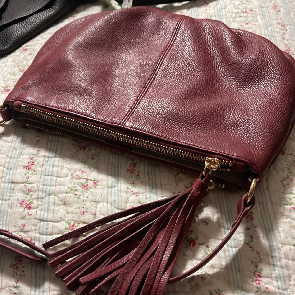 Margo Genuine Leather crossbody bag. Deep Cherry Red in Great condition. Tassels